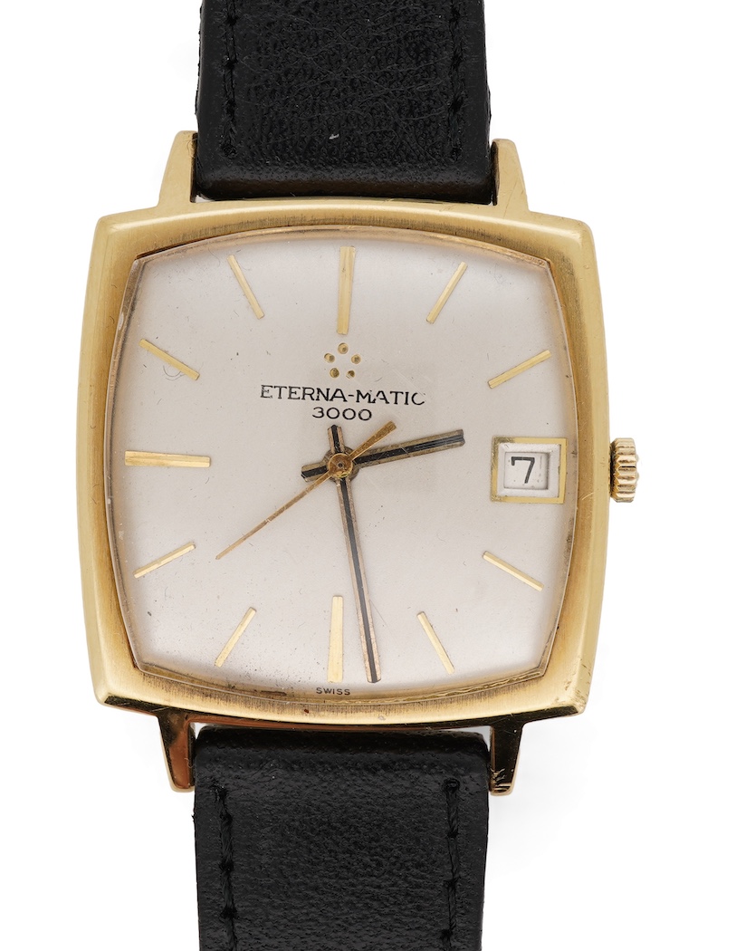 A gentleman's 18ct gold Eterna-Matic 3000 wrist watch, with baton hour marker, centre seconds hand and calendar aperture at 3 o’clock, on an associated black leather strap